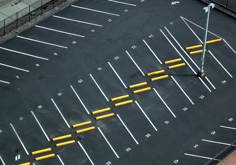 Aerial view of an empty parking lot with clearly marked lines